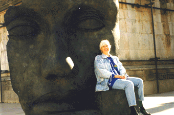 Dagmar sitting at the foot of a MITORAJ sculpture