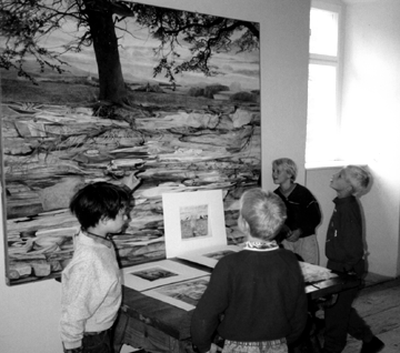 photo of kids looking at an oilpainting